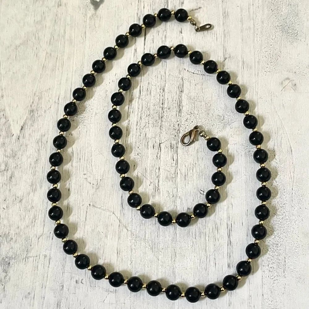 Black and gold tone beaded necklace